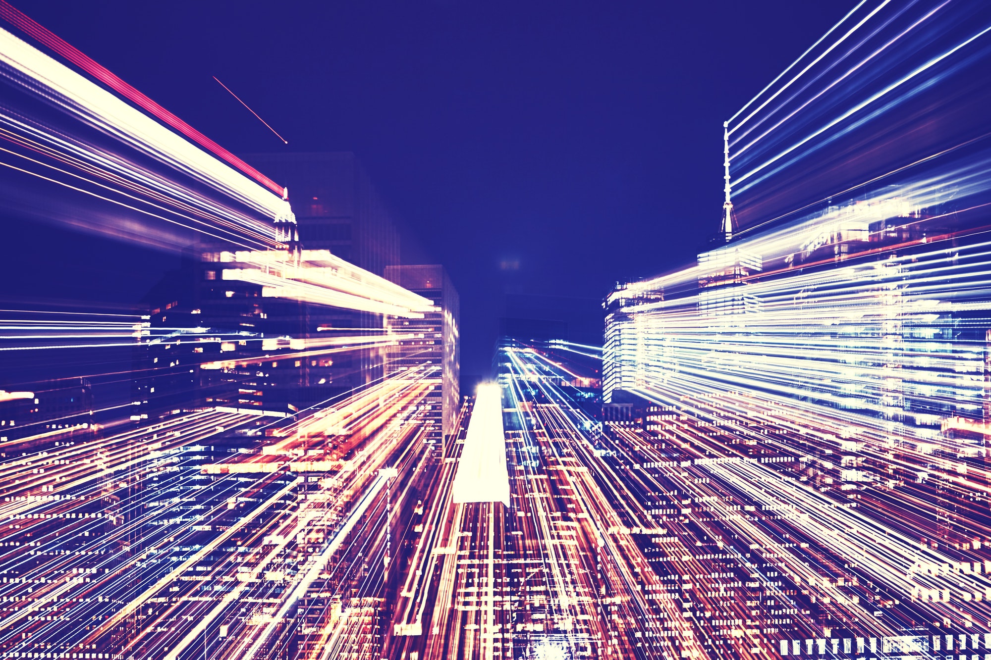 New York City night skyline with futuristic zoom effect.